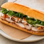 Vietnamese banh mi with pork, pate, pickled carrot and daikon, cucumber, cilantro, and jalapeno.