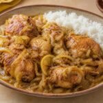 Senegalese chicken yassa with caramelized onions, lemon sauce, and white rice.