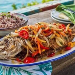 Jamaican escovitch fish topped with pickled onions, carrots, peppers, and Scotch bonnet.
