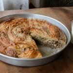 Bosnian beef burek baked in a spiral and served with yogurt.