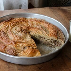 Bosnian beef burek baked in a spiral and served with yogurt.