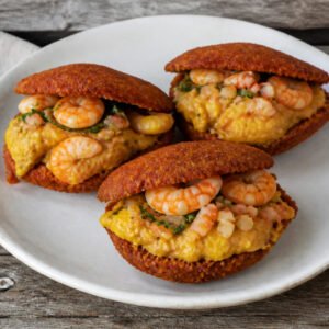 Brazilian acaraje fritters filled with vatapa, okra, vinaigrette, and shrimp.
