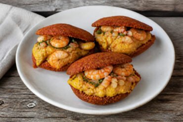 Brazilian acaraje fritters filled with vatapa, okra, vinaigrette, and shrimp.