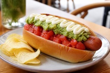 Chilean completo italiano topped with tomato, avocado, and mayonnaise.