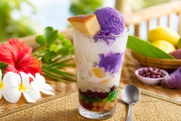 Colorful Filipino halo-halo with shaved ice, ube, fruit, beans, and leche flan.