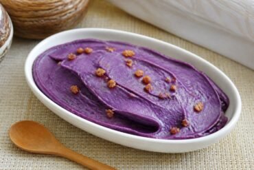 Smooth Filipino ube halaya purple yam jam topped with latik.