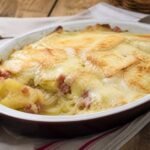 French tartiflette potato gratin with melted cheese and bacon.