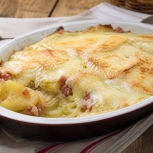 French tartiflette potato gratin with melted cheese and bacon.