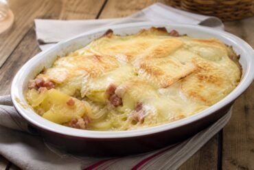 French tartiflette potato gratin with melted cheese and bacon.