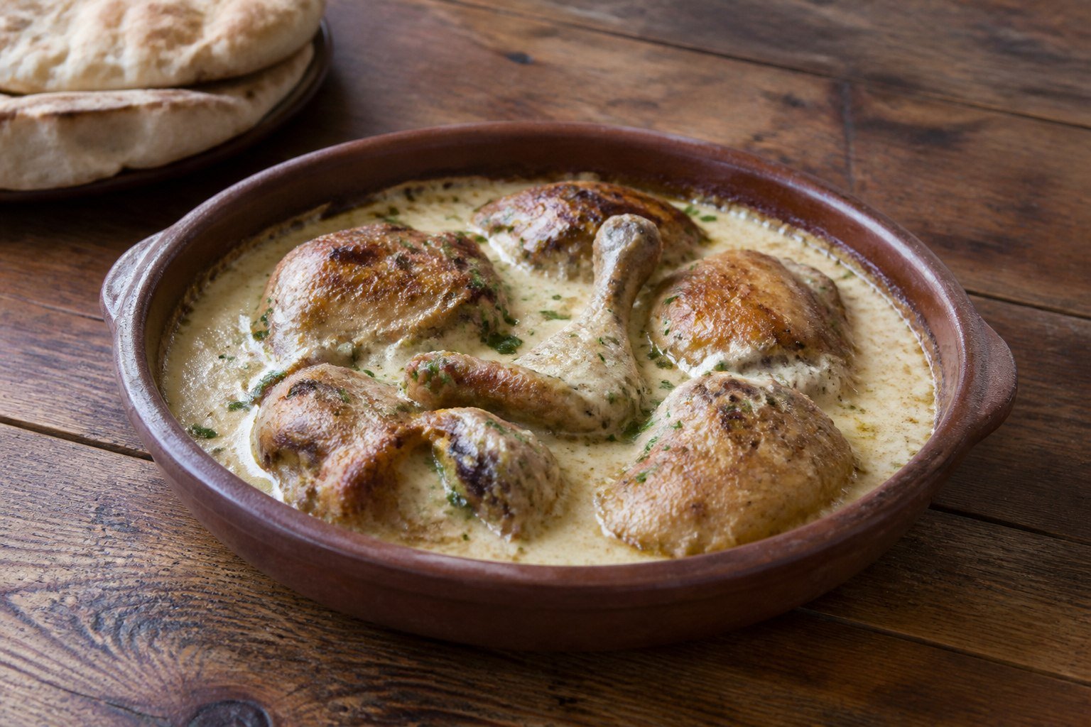 Georgian chkmeruli chicken in a creamy garlic sauce.