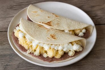 Honduran baleadas filled with refried beans, egg, cheese, and crema.