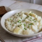 Creamy Icelandic plokkfiskur with cod, potatoes, chives, and rye bread.