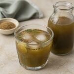 Indian jaljeera with cumin, mint, tamarind, lemon, ice, and a few pieces of boondi.