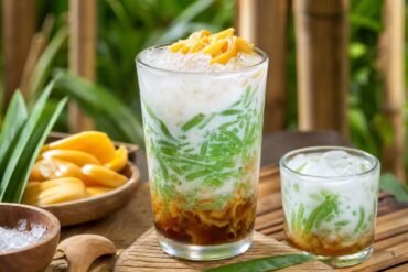 Indonesian Es Cendol with green pandan jelly, coconut milk, palm sugar, ice, and jackfruit.