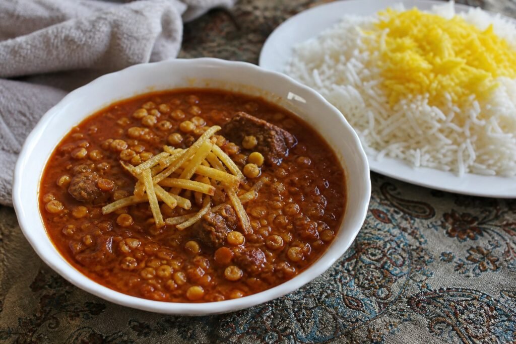 Iranian gheymeh stew with lamb, split peas, fried potatoes, and Persian rice.