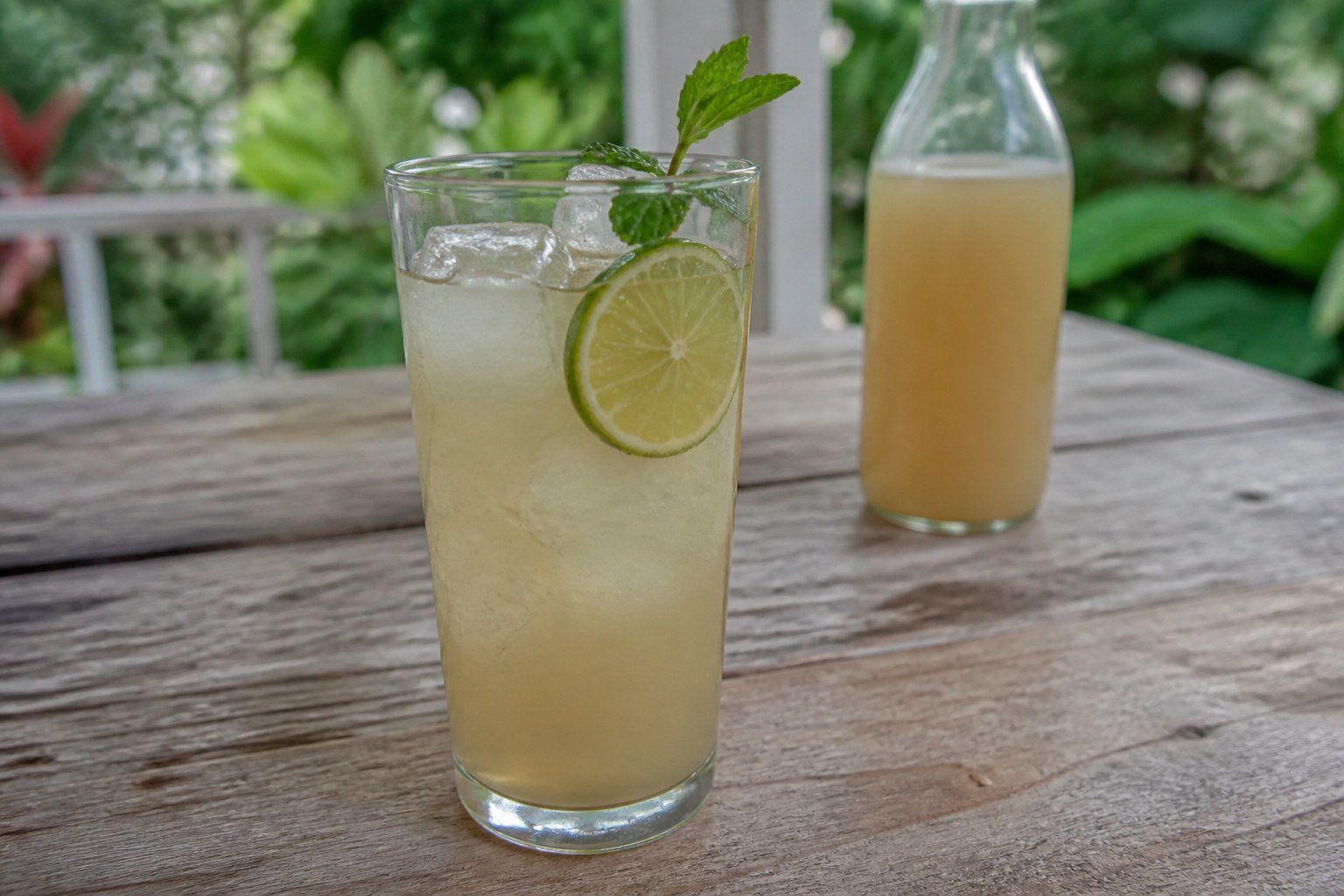 Cloudy homemade Jamaican ginger beer with lime and ice.