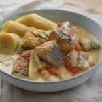 Jamaican mackerel rundown in coconut sauce with tomato, onion, and boiled green banana.