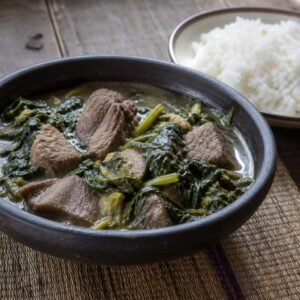 Malagasy romazava beef and leafy-greens stew served with white rice.