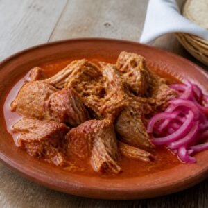 Yucatan cochinita pibil with pickled red onions and warm corn tortillas.