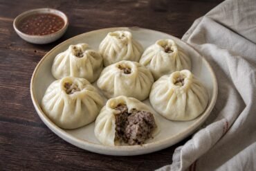 Steamed Mongolian buuz dumplings filled with beef and lamb.