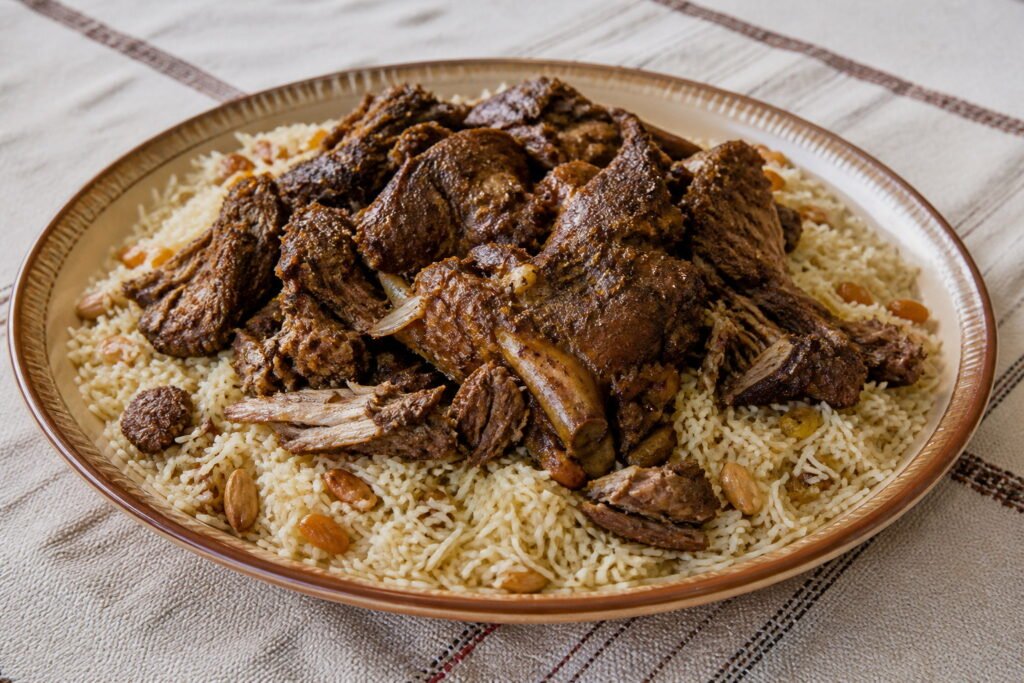 Omani shuwa served over spiced long-grain rice.