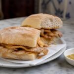 Portuguese bifana sandwiches filled with thin pork cutlets and garlicky paprika sauce.