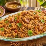 Puerto Rican arroz con gandules with seasoned rice, pigeon peas, peppers, and pork.