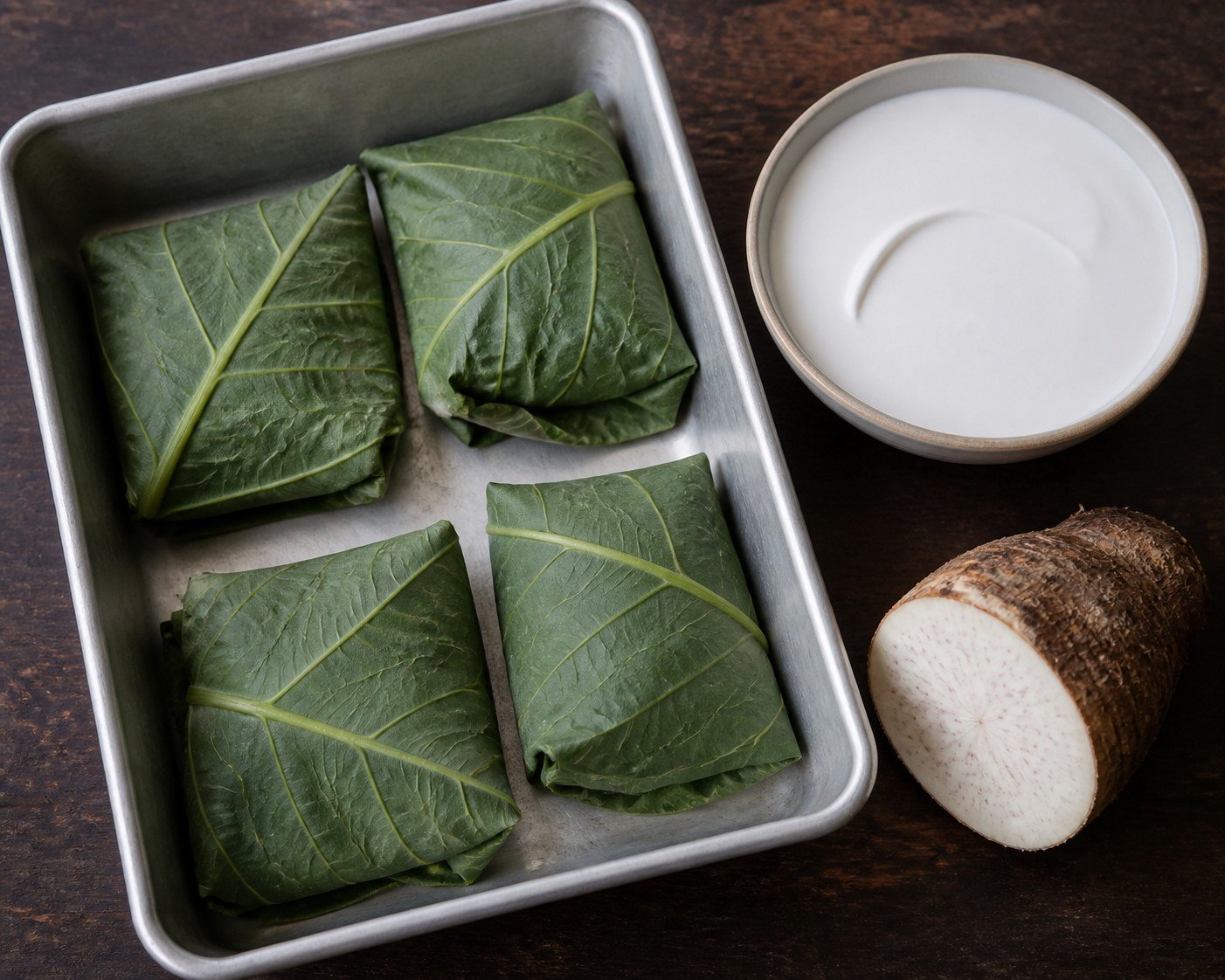 Fresh taro-leaf palusami parcels ready for baking with coconut cream.