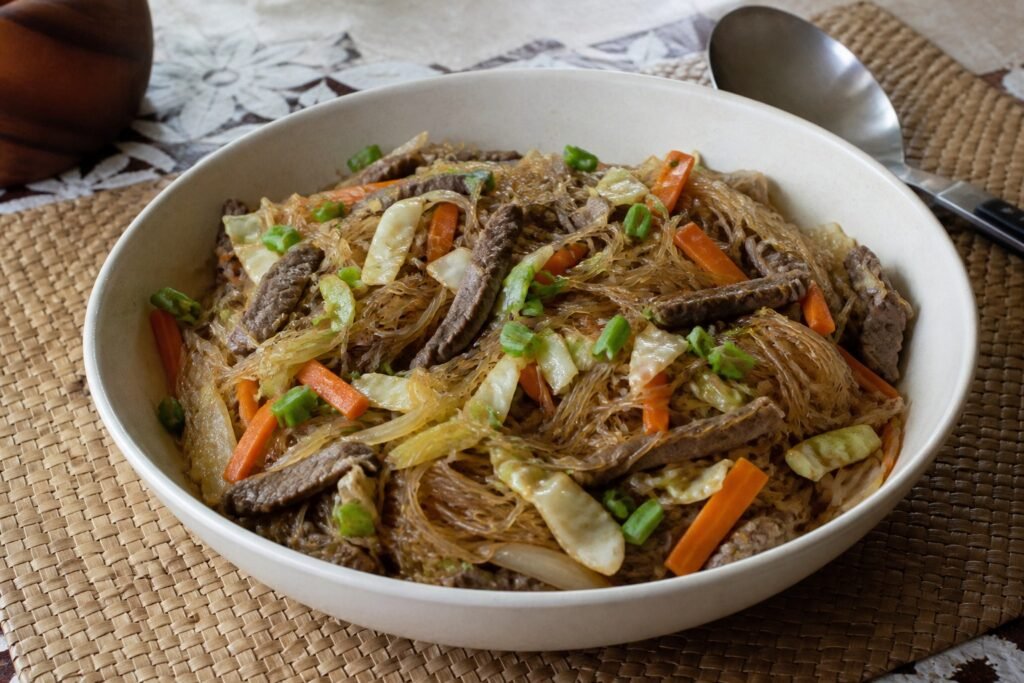 Samoan sapasui glass noodles with beef, cabbage, carrot, celery, onion, and scallions.