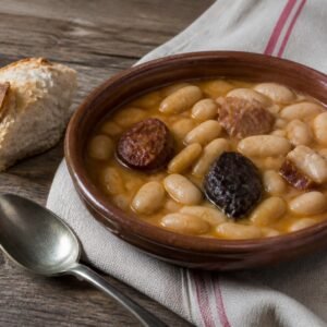 Spanish fabada asturiana with white beans, chorizo, morcilla, and pork.