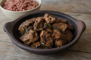 Sri Lankan fish ambul thiyal coated in a dark sour pepper spice paste.