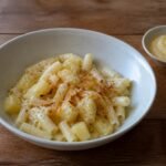 Swiss Älplermagronen with macaroni, potatoes, caramelized onions, and apple compote.