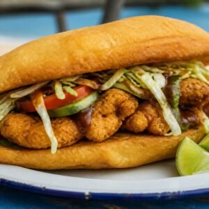 Golden Trinidadian fried bake filled with crisp fish, vegetables, and sauces.