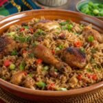 Trinidadian Pelau with caramelized chicken, pigeon peas, coconut rice, peppers, and scallions.