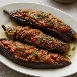 Turkish imam bayildi with soft eggplants filled with onion, tomato, garlic, and parsley.
