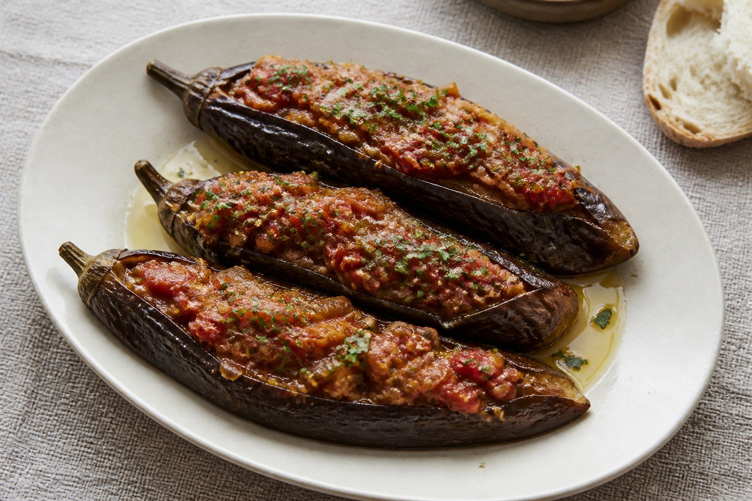 Turkish imam bayildi with soft eggplants filled with onion, tomato, garlic, and parsley.