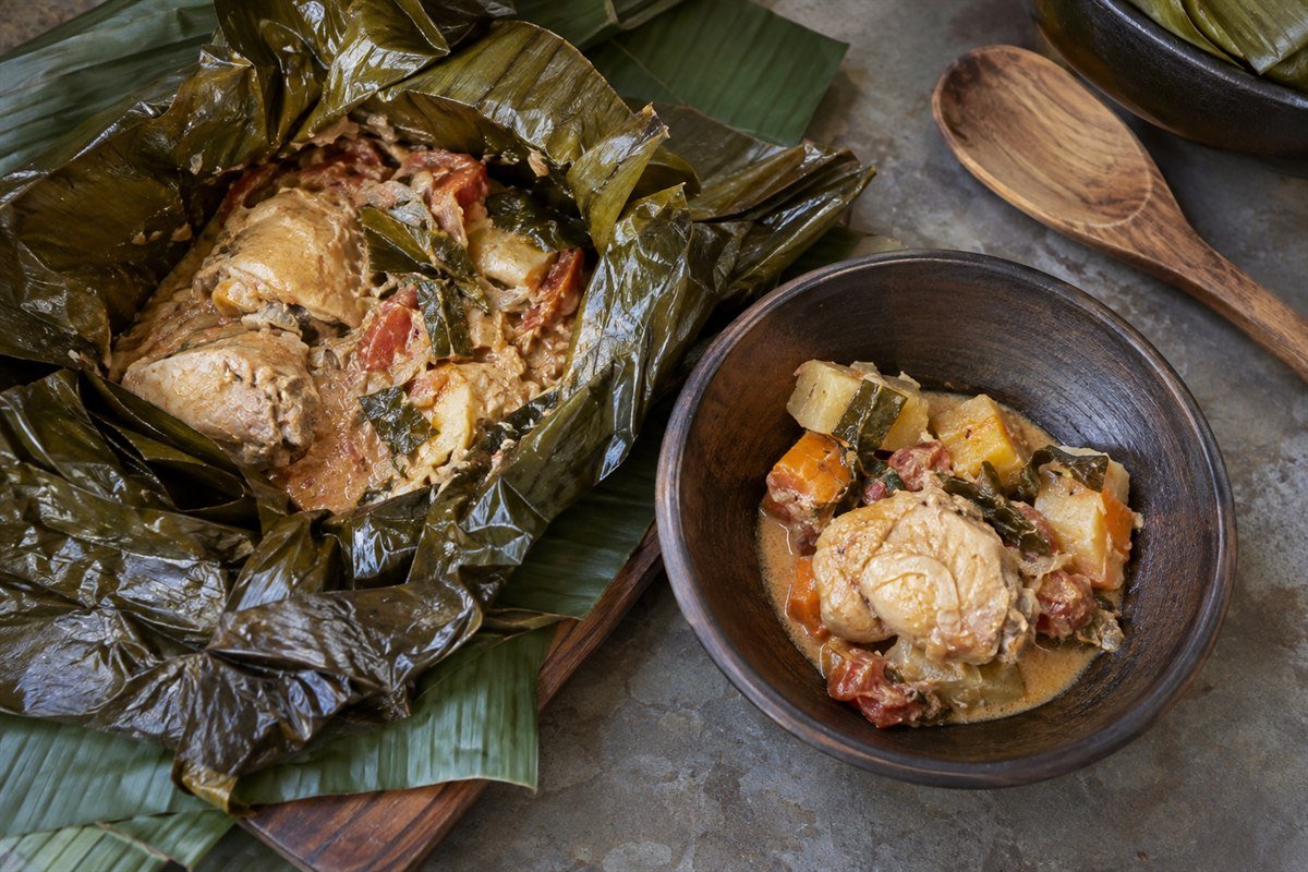 Ugandan chicken luwombo wrapped in banana leaves before steaming.